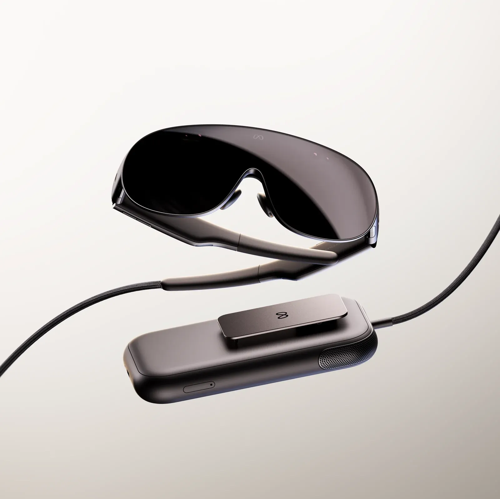 Meta VR Glasses and the Snapdragon Reality Elite compute puck joined by a fiber-optic tether