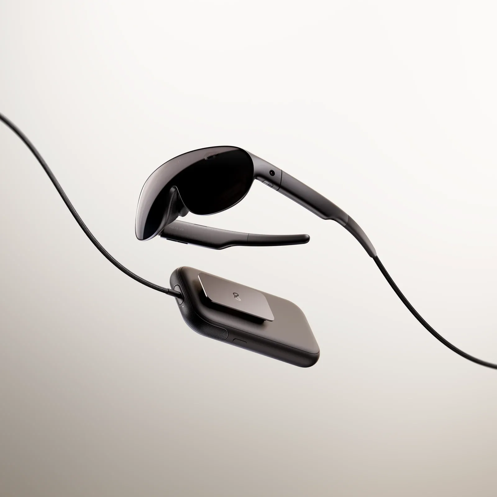 Meta VR Glasses side view — thin temples and the tether to the puck