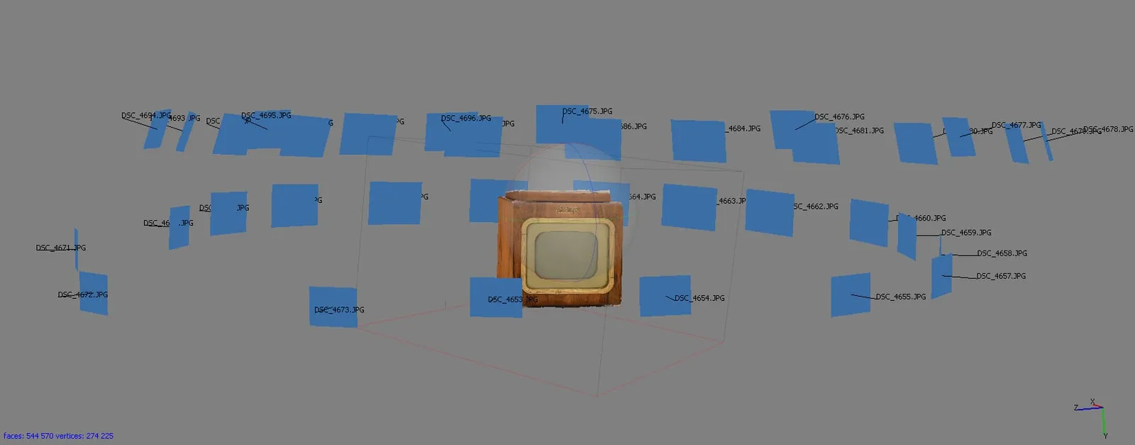 A Carbon Studio photogrammetry working file — a vintage wooden television in the center, surrounded by dozens of camera positions from which photos were taken to reconstruct the 3D model